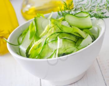 Fresh salad with cucumber and greens