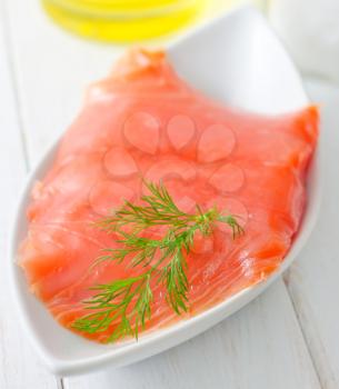 Fresh salmon in the white bowl