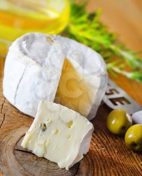 Italian cheese with olives and rosemary