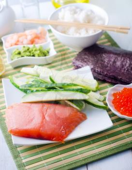 ingredients for sushi, sakmon and cucumber