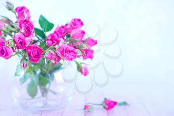 flowers in vase and on a table