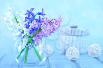 flowers in vase and on a table