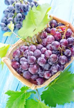 grape in basket and on a table