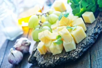 cheese and grape on the wooden board