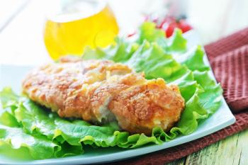 chicken breast with salad on the plate