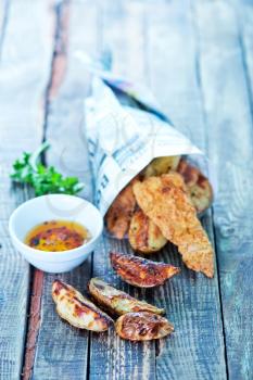 fish and chips on the wooden table