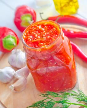 Fresh chilli sauce in the glass bank