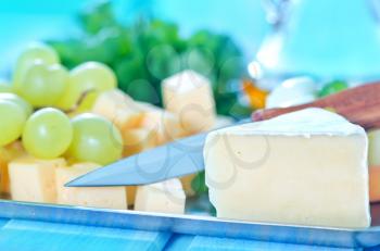 cheese cubes and grape on metal tray