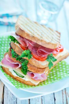 sandwiches with ham and cheese on the plate