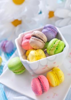macaroons in bowl and on a table