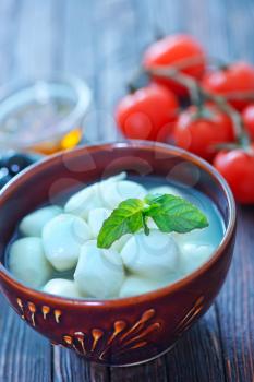 mozzarella in bowl and on a table