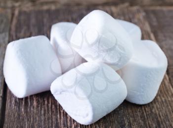 white marshmallows  on the wooden table, fresh and sweet marshmallows