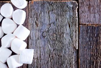 white marshmallows  on the wooden table, fresh and sweet marshmallows