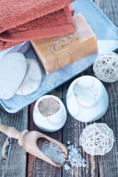 Soap and Body Lotion on the Wooden Background