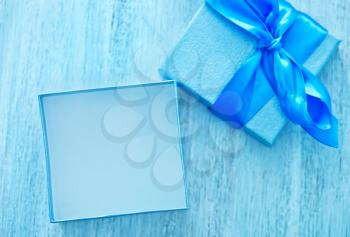 blue box for present on the wooden table