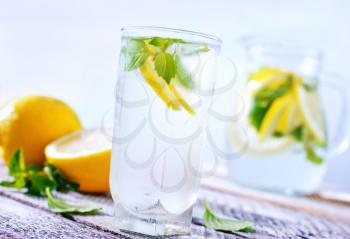 fresh lemonad in glass and on a table