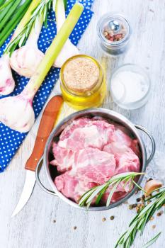 raw meat with spice and salt in metal bowl