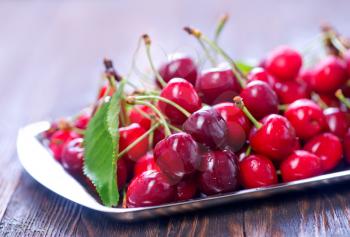 fresh red cherry onthe wooden table