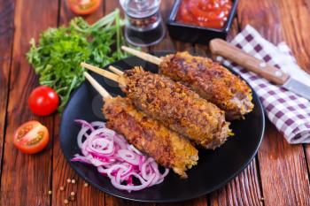 fried kebab with spice and fresh tomato