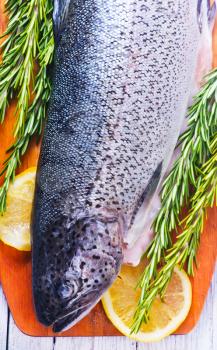 raw fish with spice and salt on a table