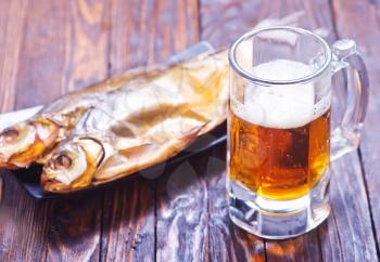 smoked fish on plate and on a table