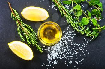 fresh lemon with aroma oil and salt on a table