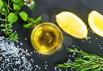 fresh lemon with aroma oil and salt on a table