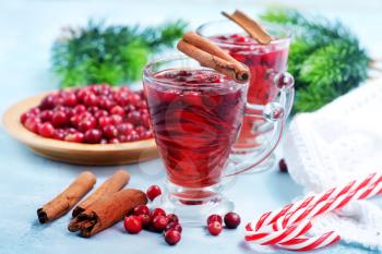 cranberry drink and berries, christmas drink in glass and on a table