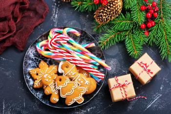 cookies and candycane on a table, christmas background