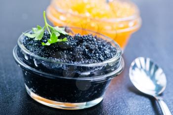 caviar in glass bowls and on a table