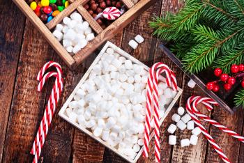 christmas candy in box and on a table