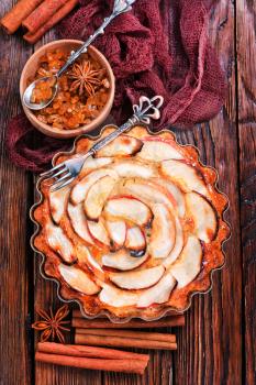 apple pie with cinnamon on a table