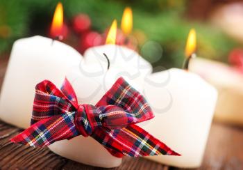 candles with ribbon on a table, christmas decoration