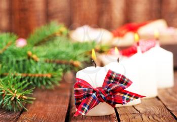 candles with ribbon on a table, christmas decoration