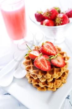 waffles on plate and on a table