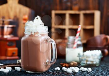 cocoa drink in glass bank and on a table