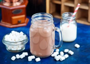 cocoa drink in glass bank and on a table