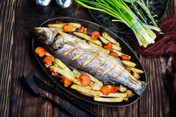 baked fish with vegetable on a table