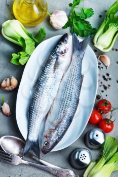 raw fish with spice and fresh salad