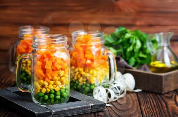 fresh salad with corn and green peas in bank