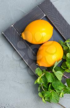 fresh lemon with fresh mint on a table