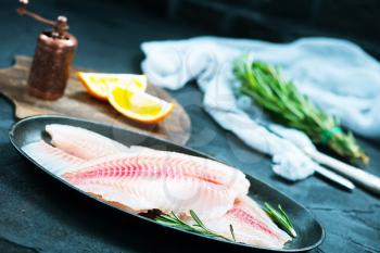 raw fish with spice and on a table