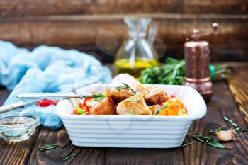 fried meat with vegetables in the bowl