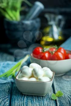 mozzarella in bowl and on a table