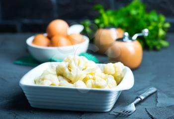 boiled cauliflower in bowl and on a table