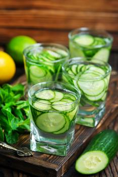 cucumber drink in glass and on a table