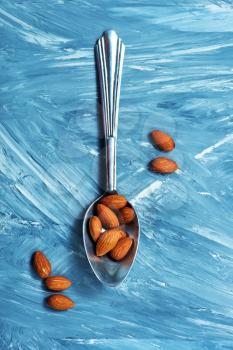 almond on a table, dry almond, nuts on wooden background