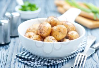 fried potato in bowl and on a table