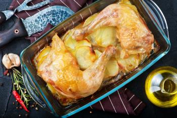 fried chicken with potato in bowl and on a table