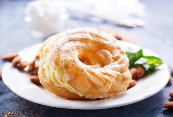 pastry rings with cream on the plate